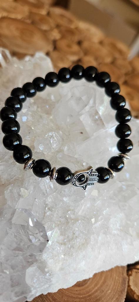 Schwarzes Perlenarmband mit Hand der Fatima Symbol in Silber