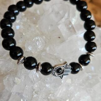 Schwarzes Perlenarmband mit Hand der Fatima Symbol in Silber